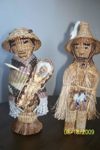 Judy and Heather Gobin's blue-ribbion winning "Agnes James-style" dolls, made of yellow cedar, with clothing of wool, sweet grass, yellow cedar, and ermine. Photo courtesy of Judy Gobin